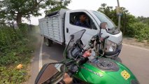 Biker's Helmet Cam Captures Close Call With Truck