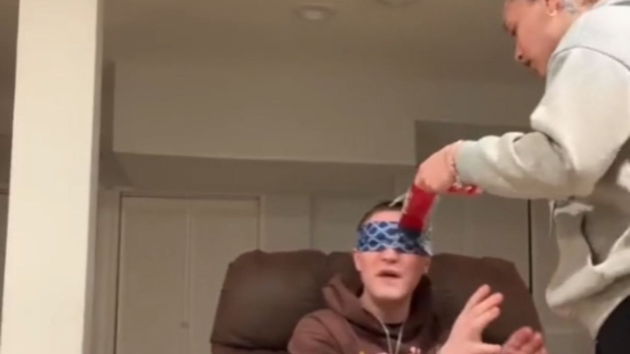 Girlfriend pulls a hilarious blind-fold prank on boyfriend with her dog