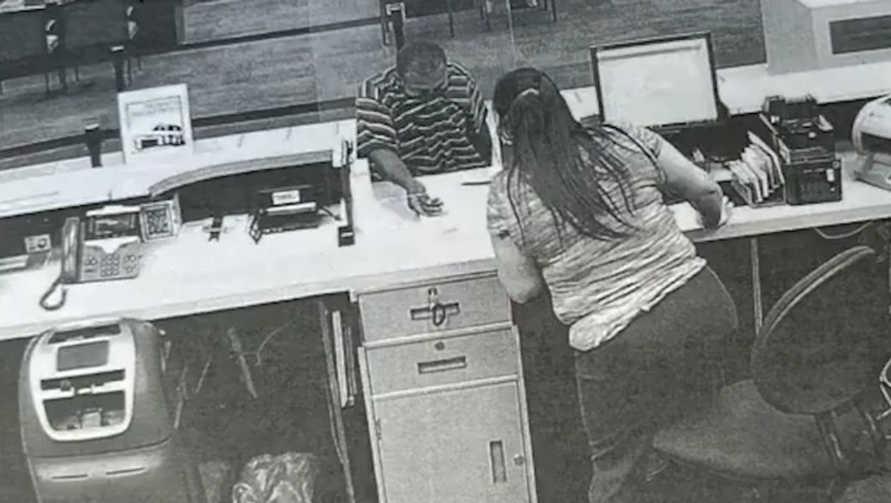 Mind-boggling moment passerby stops bank robbery by giving suspect a hug