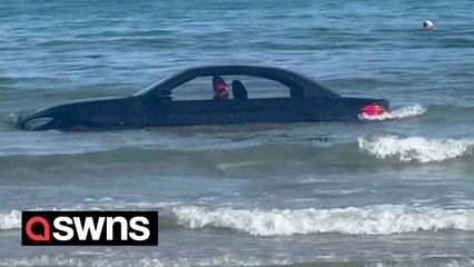 Coastguard jokes “you can’t park there!” after a BMW is washed out to sea