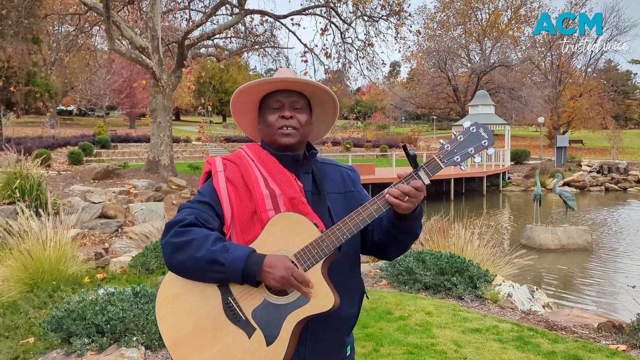 Kenyan musician Joel Kimeto performs praise song at Wagga Botanic Gardens