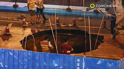 Caught on cam: Scooter rider busy on phone rides scooter straight into a giant sinkhole