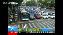 China policeman gives elderly man a piggy back