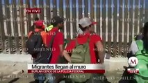 Migrantes intentan cruzar muro fronterizo; agentes de Estados Unidos lanzan gas lacrimógeno