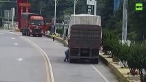 Moment truck tire explodes as Chinese driver tries to fix it