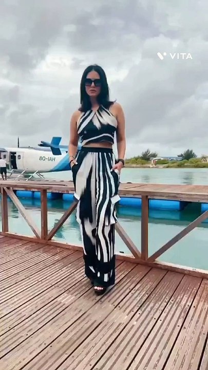 Sunny Leone in a monochrome cropped top with halter neckline