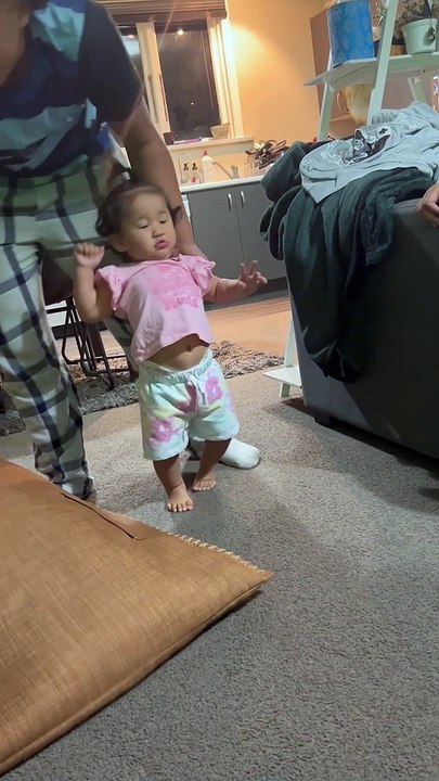 Big Brother Helps Little Sister Learn to Walk