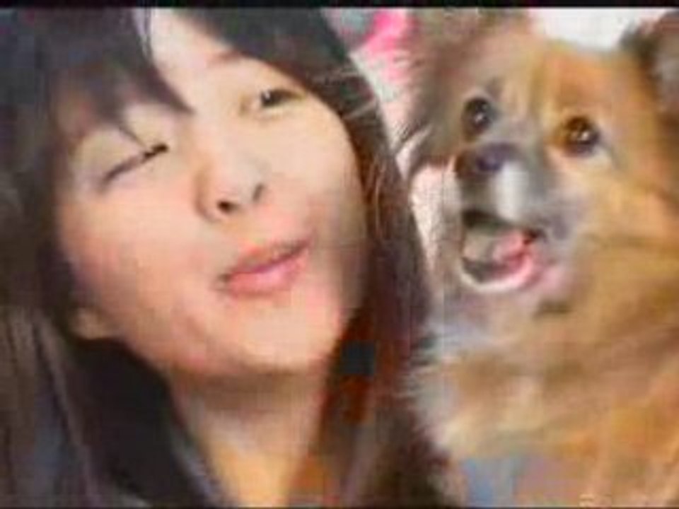 Cute Girl in Bed with a Dog