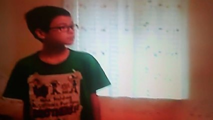 Jonathan watches tv while Christopher & Anthony play on their electronics