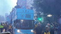 Man City parade: Manchester celebrates the club winning the historic treble with an open-top bus parade through the city centre streets