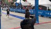 SURREAL moment as dad finishes Marathon while holding his toddler daughter