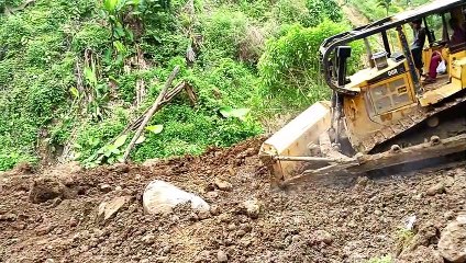 Caterpillar Bulldozer D6R XL Blocked With Large Rock at Mountain Top