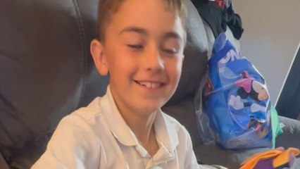 Pure joy sweeps across boy's face after being surprised with his favorite women's basketball player's jersey