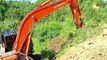 Hitachi 210 MF Excavator Efficient Palm Land Clearing in Mountain Plantations
