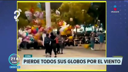 Vendedora pierde sus globos por el viento