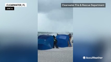 Waterspout sends debris flying on Florida beach