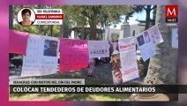 En Veracruz, colectivos feministas colocan tendederos de deudores alimentarios en el Día del Padre