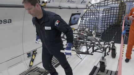 Astronaut Testing Lunar Wheelbarrow In Moon-Like Gravity On Parabolic
