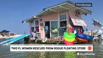 Two women rescued from rogue floating store during storm