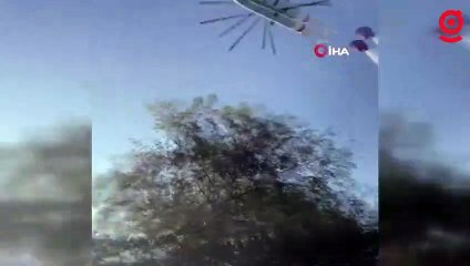 Helikopterin soğutma çalışmasını çeken muhabirler tonlarca suyun altında kalmaktan son anda kurtuldu