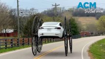 Tesla driver replaces tyres with 10-foot tall wagon wheels