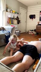 Toddler Jumps Onto Dad From Couch