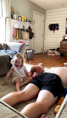 Toddler Jumps Onto Dad From Couch