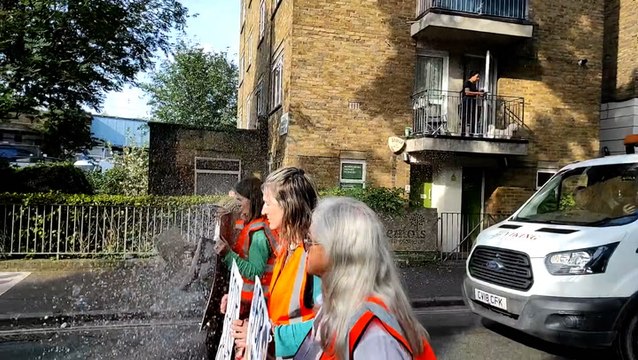 Man throws water over Just Stop Oil protesters