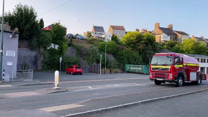Fire engine rushing through Pembroke with lights and siren to attend an apartment fire in Monkton