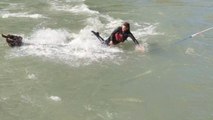 Man loses his grip while wakeboarding and goes with the river's flow