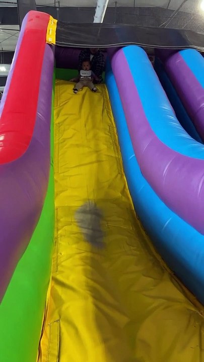 Father Saves Son From Falling Off Inflatable Slide