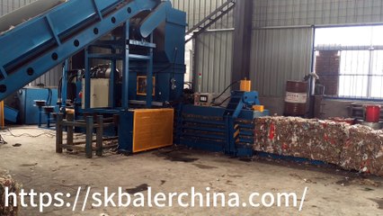 Top load baling machines