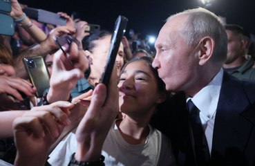 Vladimir Putin greets the public and poses for SELFIE