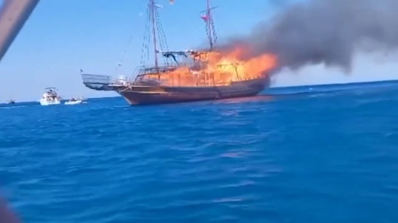Dramatic Moment_ Dozen British Tourists Rescued After Abandoning Enflamed Greek Boat
