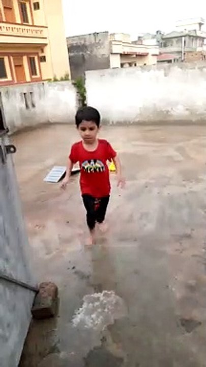 Kids Enjoying on a rainy Day at Islamabad
