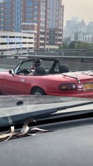 Convertible Driver Wears Respirator Mask