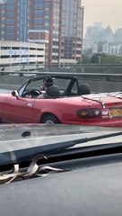 Convertible Driver Wears Respirator Mask