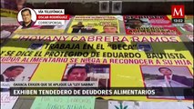 Activistas exhiben tendedero de deudores alimentarios en Oaxaca; exigen que se aplique la Ley Sabina