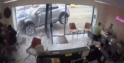Watch shocking moment car smashes through Sheffield hairdressers shop front at high speed