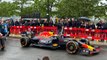 Daniel Ricciardo drives Red Bull Racing car in Milton Keynes