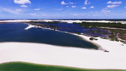 Drone Footage Of The Sea And Sand Of A Scenic Beach