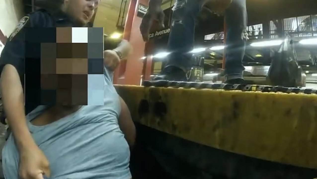 Police pull passenger from subway tracks in tense bodycam footage