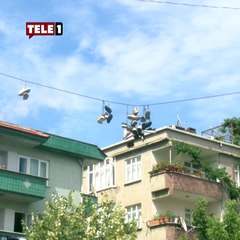 Gören bir daha baktı! Elektrik tellerine asılan ayakkabılar mahallede merak yarattı