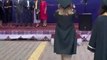 Woman Trips Over and Falls While Going Onstage During Graduation Ceremony
