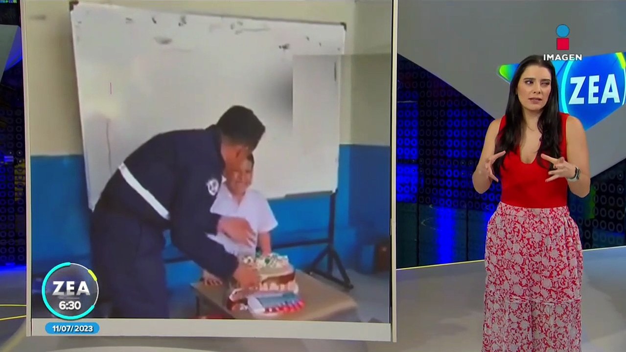Papá sorprende a su hijo con pastel de cumpleaños en salón de clases