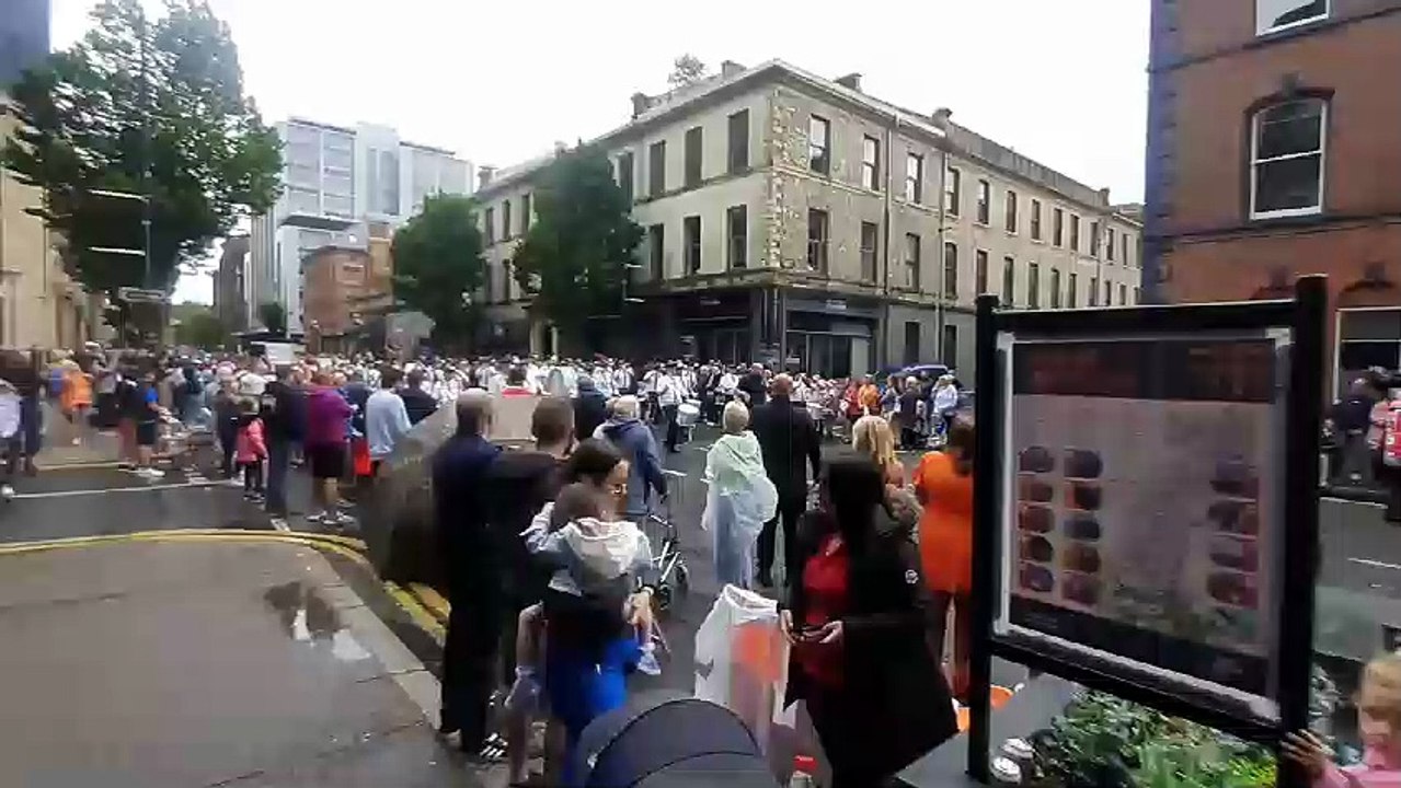 A band pauses and entertains onlookers during t...