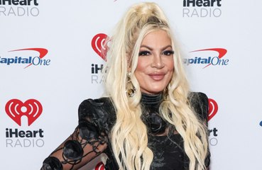 Tori Spelling moves into a motel with her five kids, but says it's not because of her alleged split from Dean McDermott