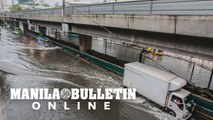 Motorists brave through the flooded Taft Avenue in Manila