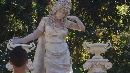 Living statue performer mesmerizing people in the Busch Gardens, Tampa