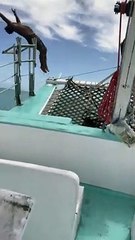 Man Does Backflip Off of Boat Going Over Big Wave